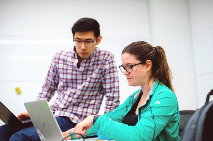 Students studying at laptop