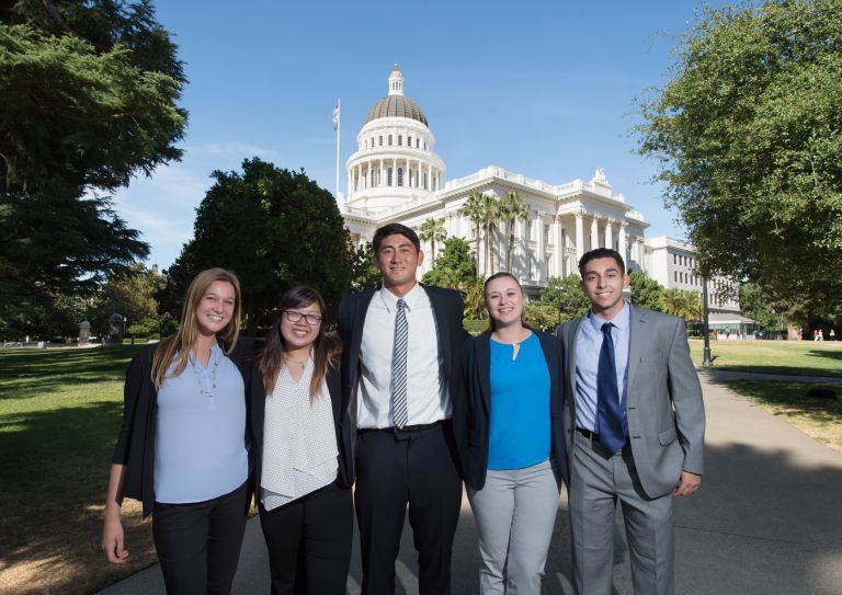 Students standing in front of Capitol building 