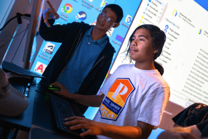 Two students looking at a computer screen