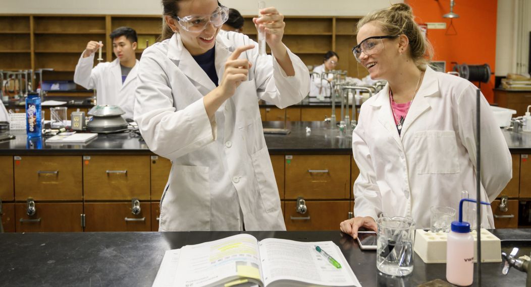chemistry students performing lab tests
