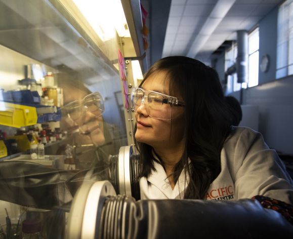 chemistry professor using equipment