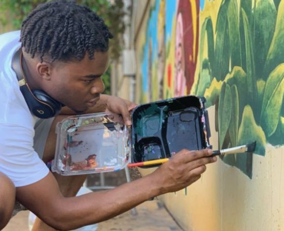 studio art student painting mural